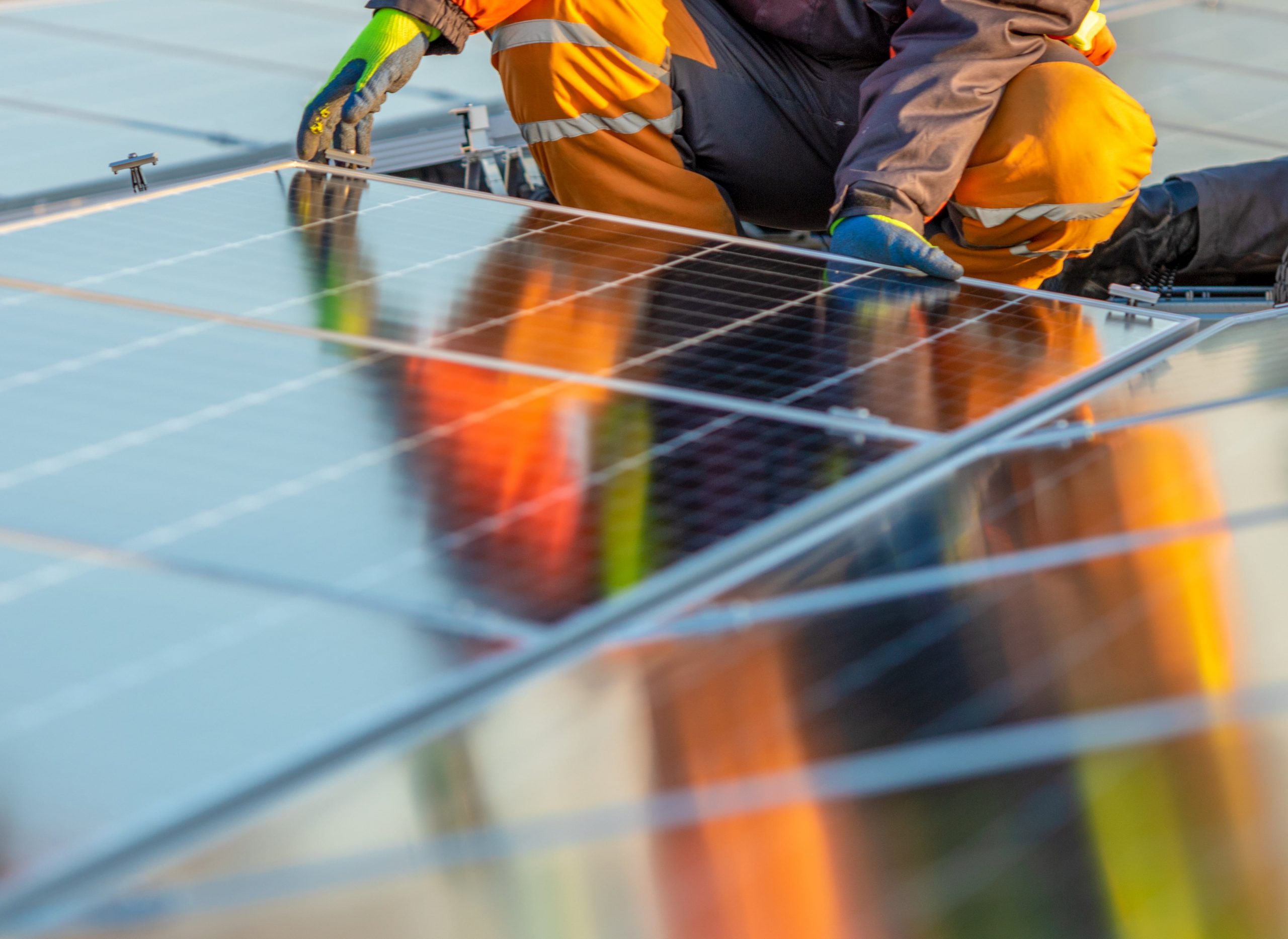 man installing solar panels