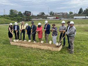 Team of executives about to break ground for new community solar installation