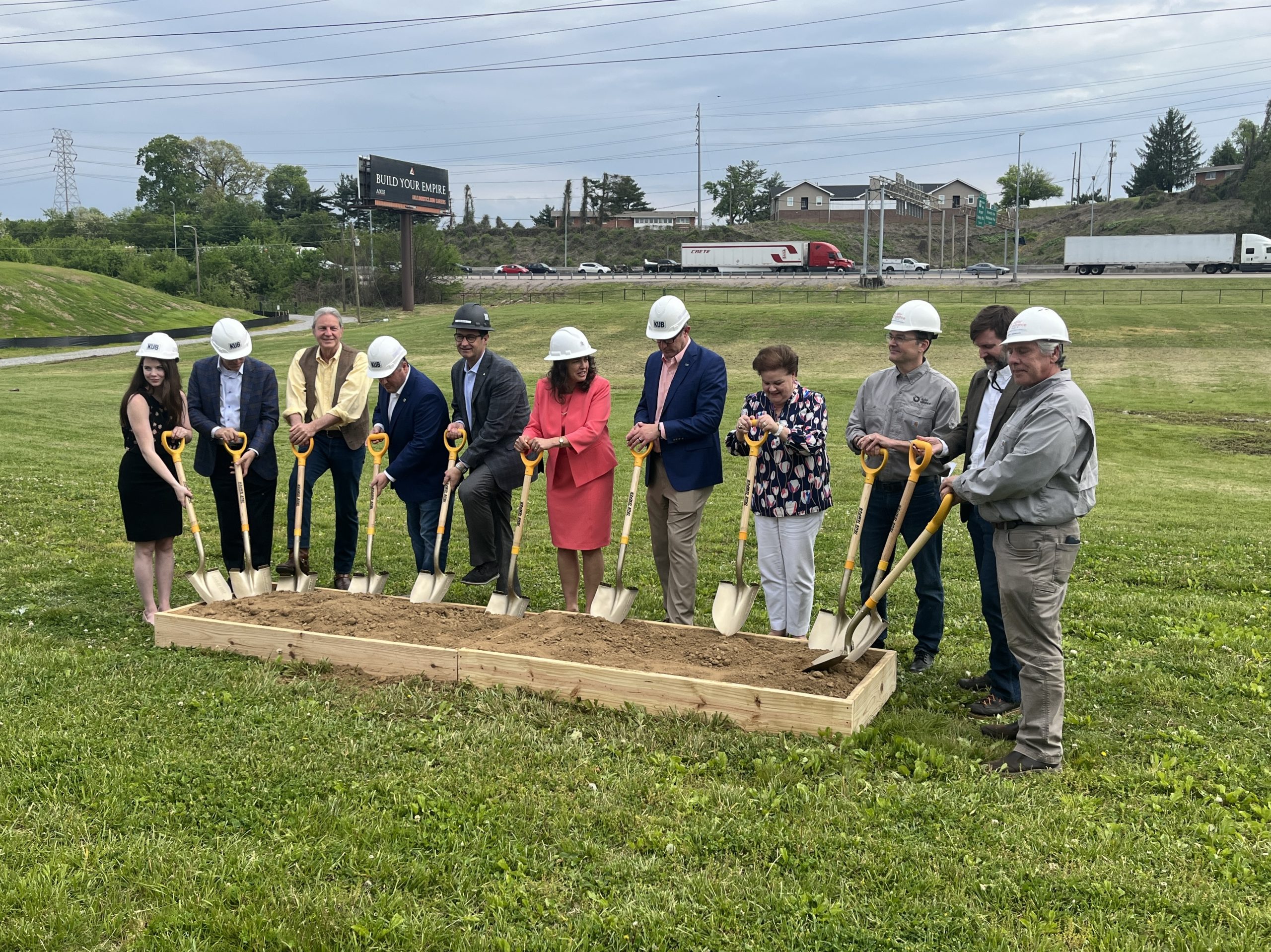 Team of executives breaking ground for new community solar installation