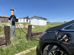 An EV Charger connected to an electric car