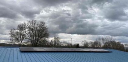 Blue roof that has residential solar panels installed