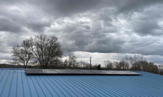 Blue roof that has residential solar panels installed