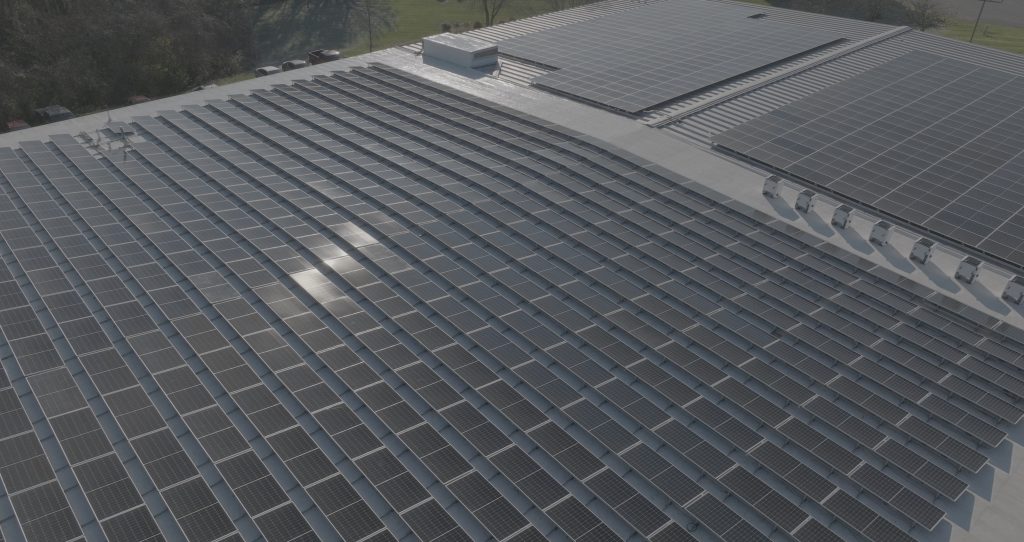 Solar array fills the rooftop for AESSEAl's North American headquarters.