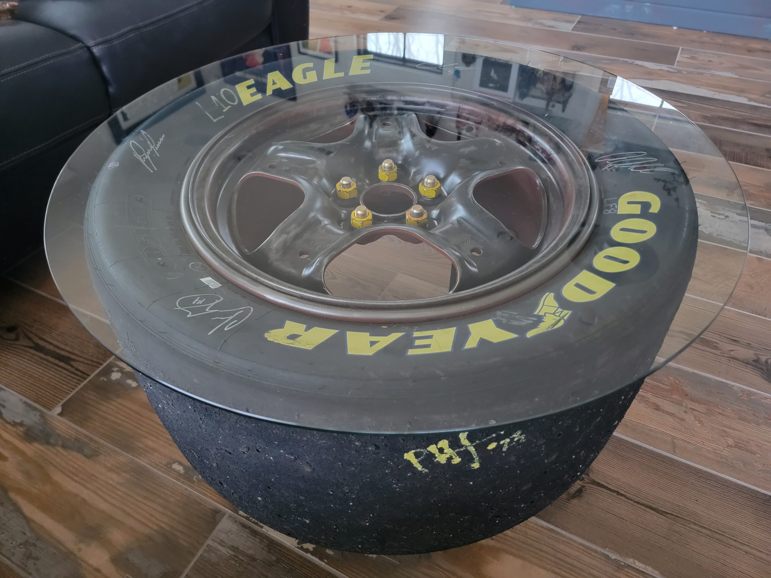 NASCAR tire signed by Chase Briscoe, Aric Almirola, Cole Custer and ryan Preece