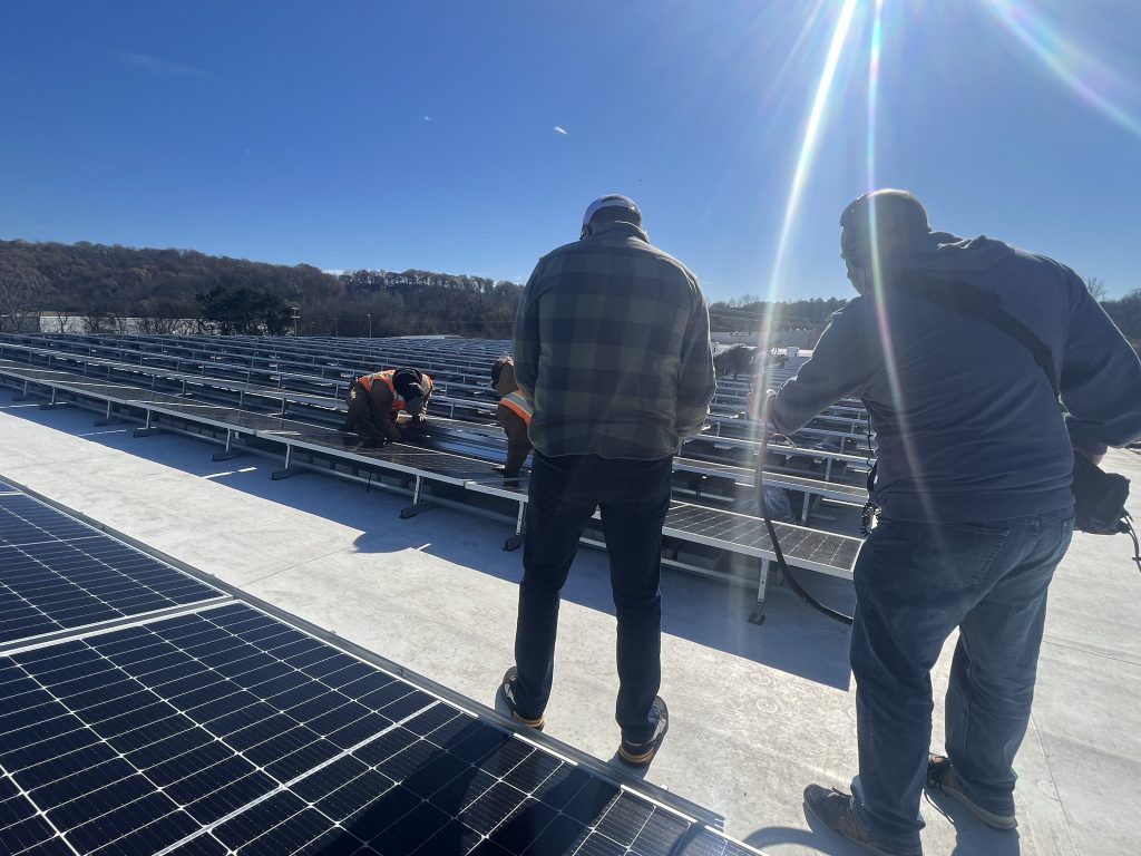 Sunshine rays upon rooftop full of solar.